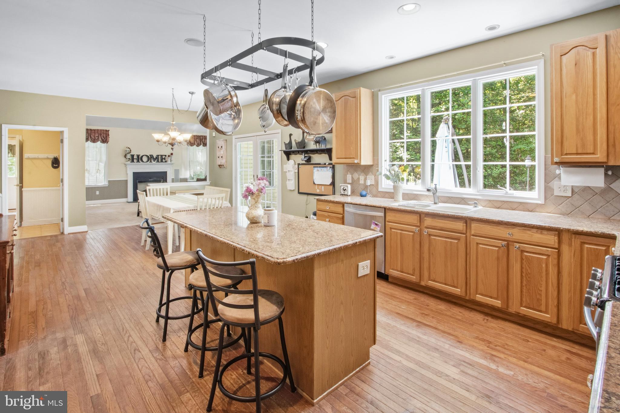 15 Hollybrook Road Mullica Hill, NJ 08062 - Photo 2 of 38 a kitchen with a sink cabinets and wooden floor