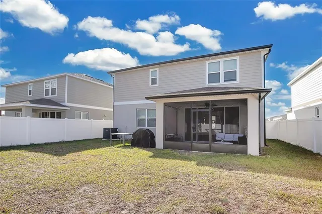 a view of a house with a yard and balcony