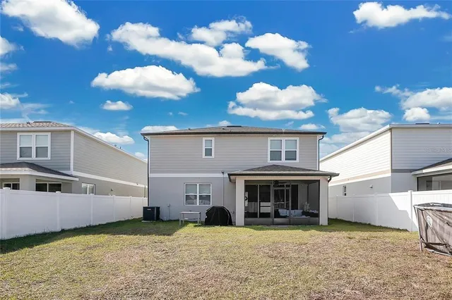 a view of a big yard with an outdoor space