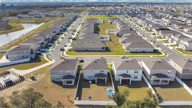 an aerial view of a house with a swimming pool