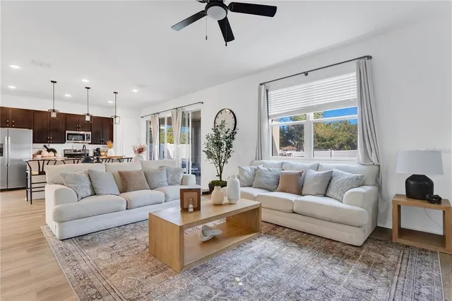a living room with furniture and a large window