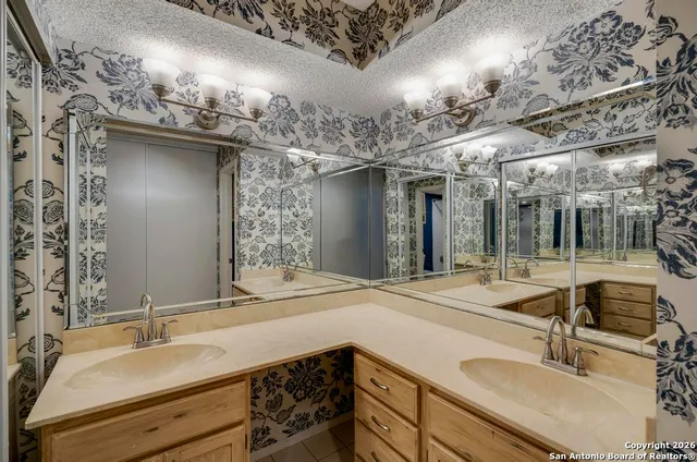 a bathroom with a sink and a mirror