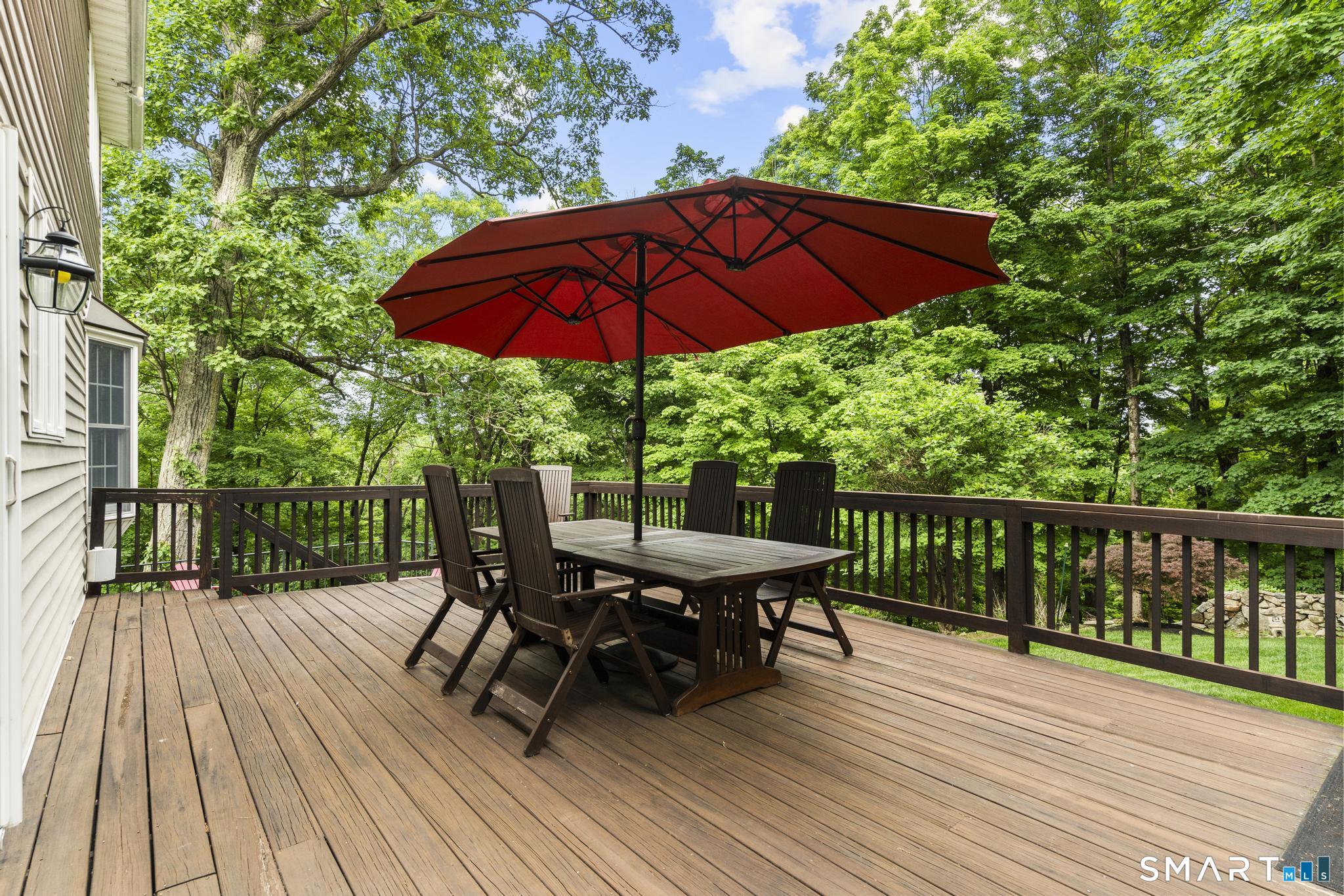 12 Logans Way Danbury, CT 06811 - Photo 31 of 40 a view of balcony with outdoor seating and wooden floor