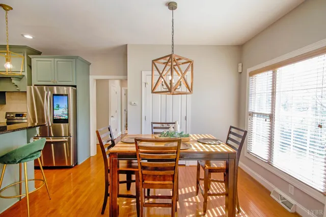 a kitchen with stainless steel appliances granite countertop a refrigerator stove and sink