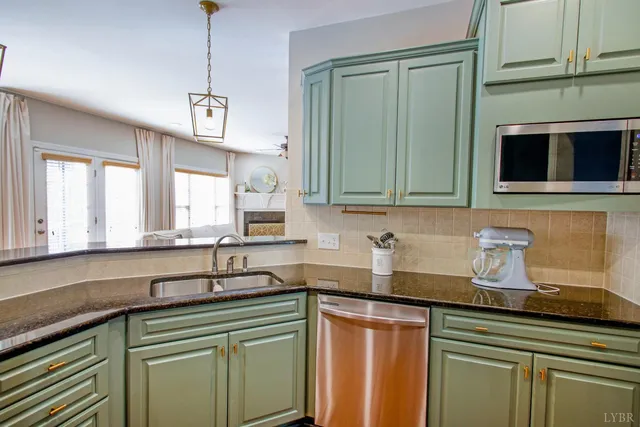 a spacious bedroom with a bed a couch and a flat screen tv