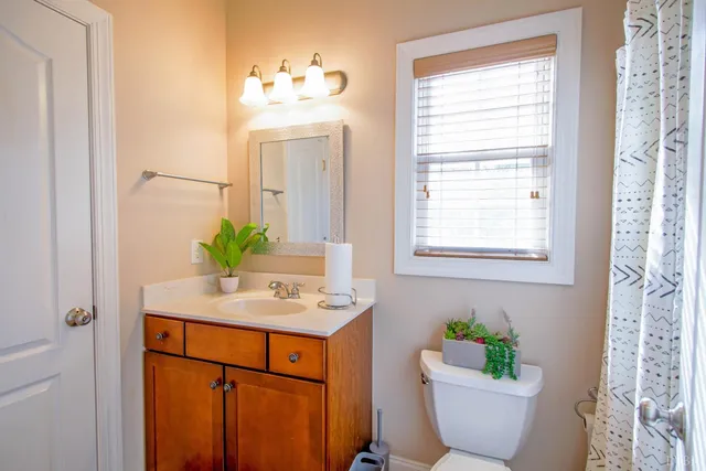 a spacious bathroom with a double vanity sink and a mirror