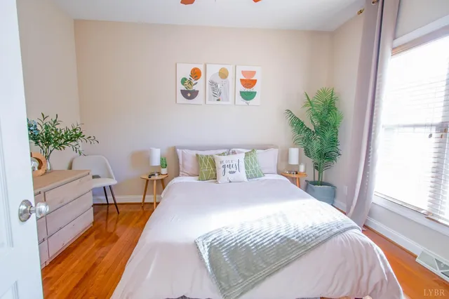 a spacious bathroom with a granite countertop sink a mirror and a shower