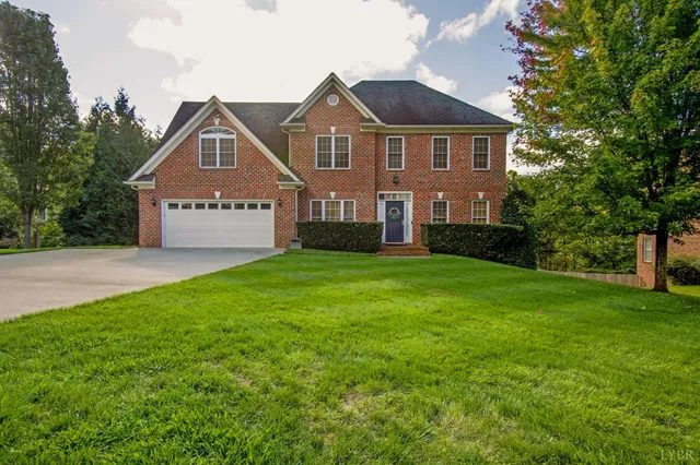 a living room with furniture a chandelier and a window