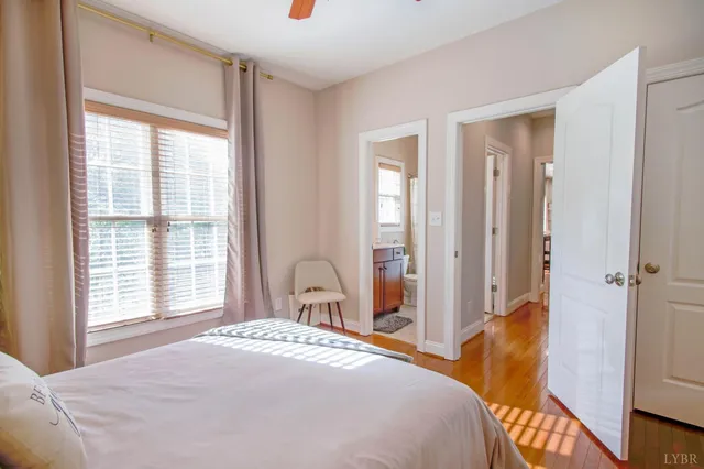 a bathroom with a tub a sink and a window