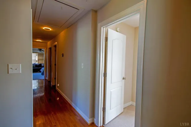 a living room with a bed furniture and a window