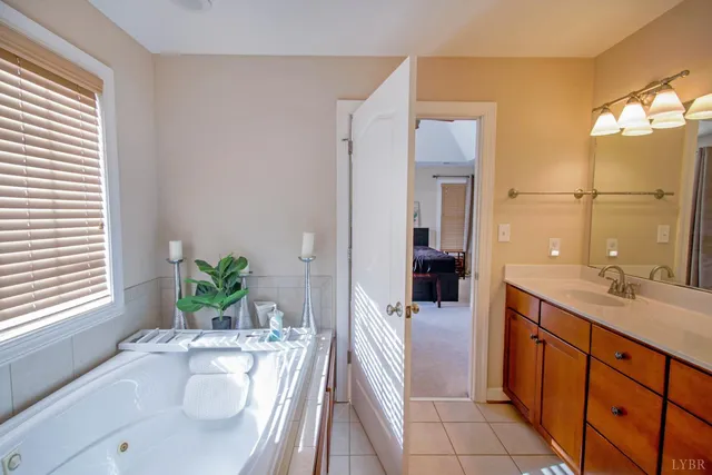 a view of a kitchen with stainless steel appliances granite countertop a sink and a refrigerator