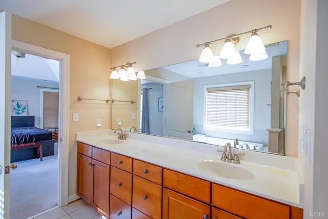 a view of a room with wooden floor and a window
