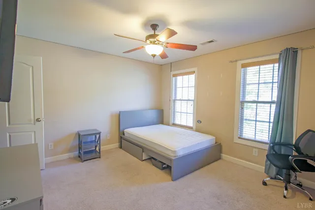 an aerial view of a house with a yard and potted plants