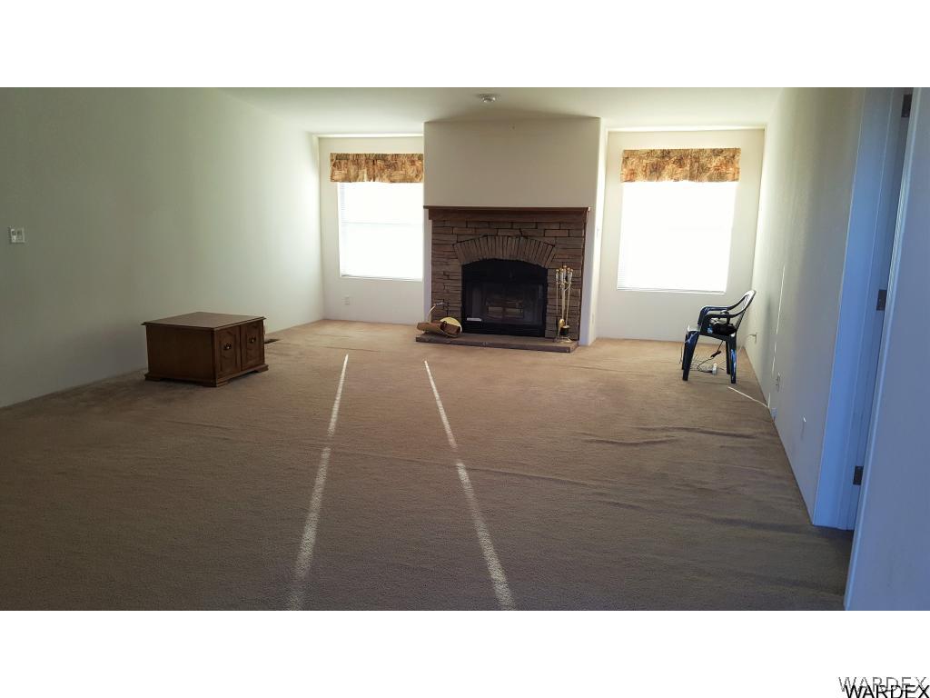 5341 North Laguna Road Golden Valley, AZ 86413 - Photo 4 of 31 Living room with fireplace