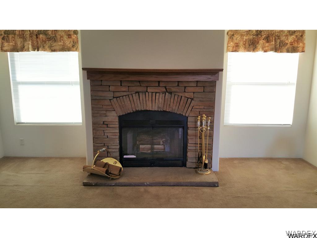 5341 North Laguna Road Golden Valley, AZ 86413 - Photo 5 of 31 Cozy up to the fireplace