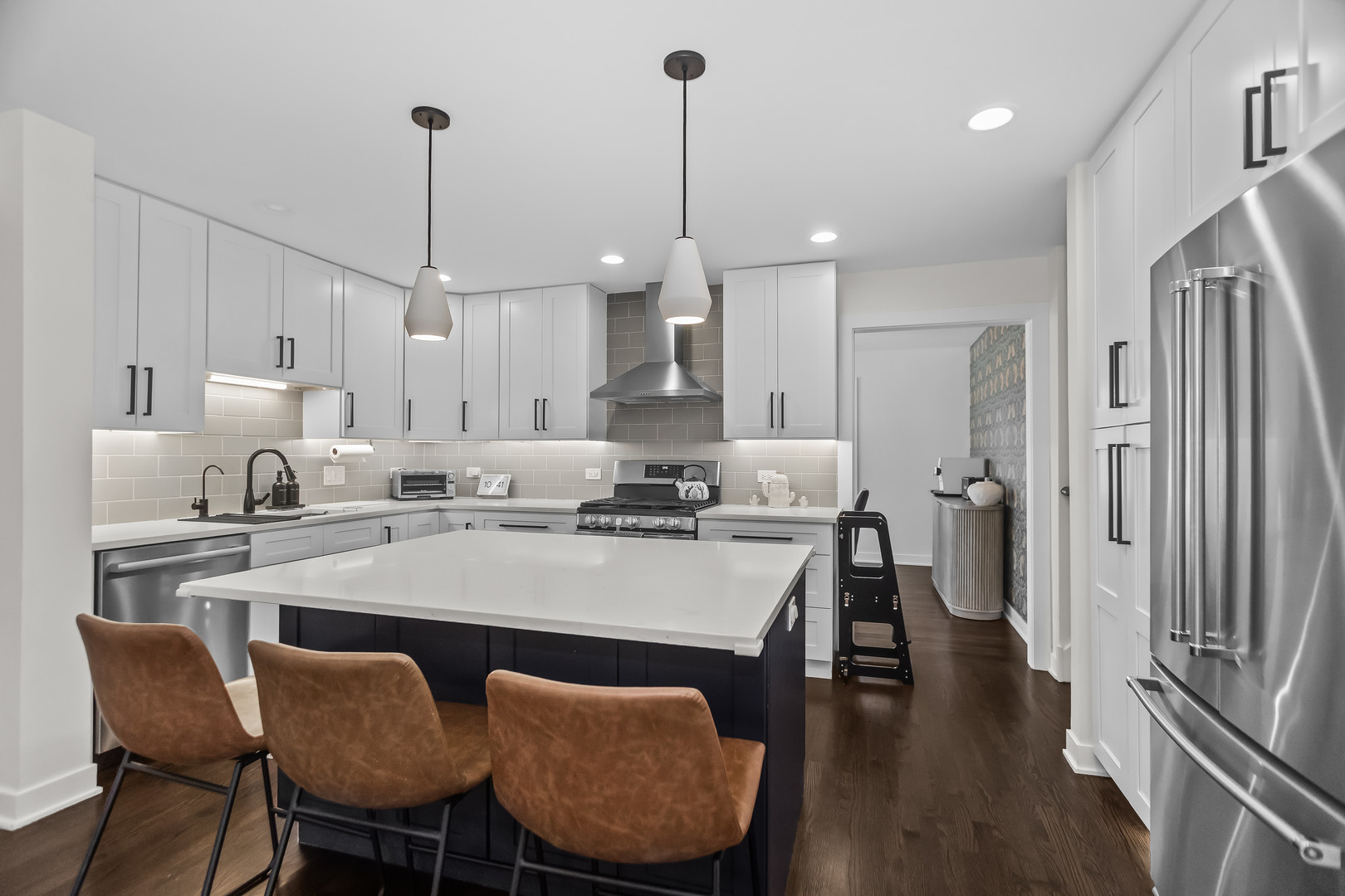 3240 Pitcher Drive Darien, IL 60561 - Photo 11 of 43 a large kitchen with sink a refrigerator a counter space and a dining table