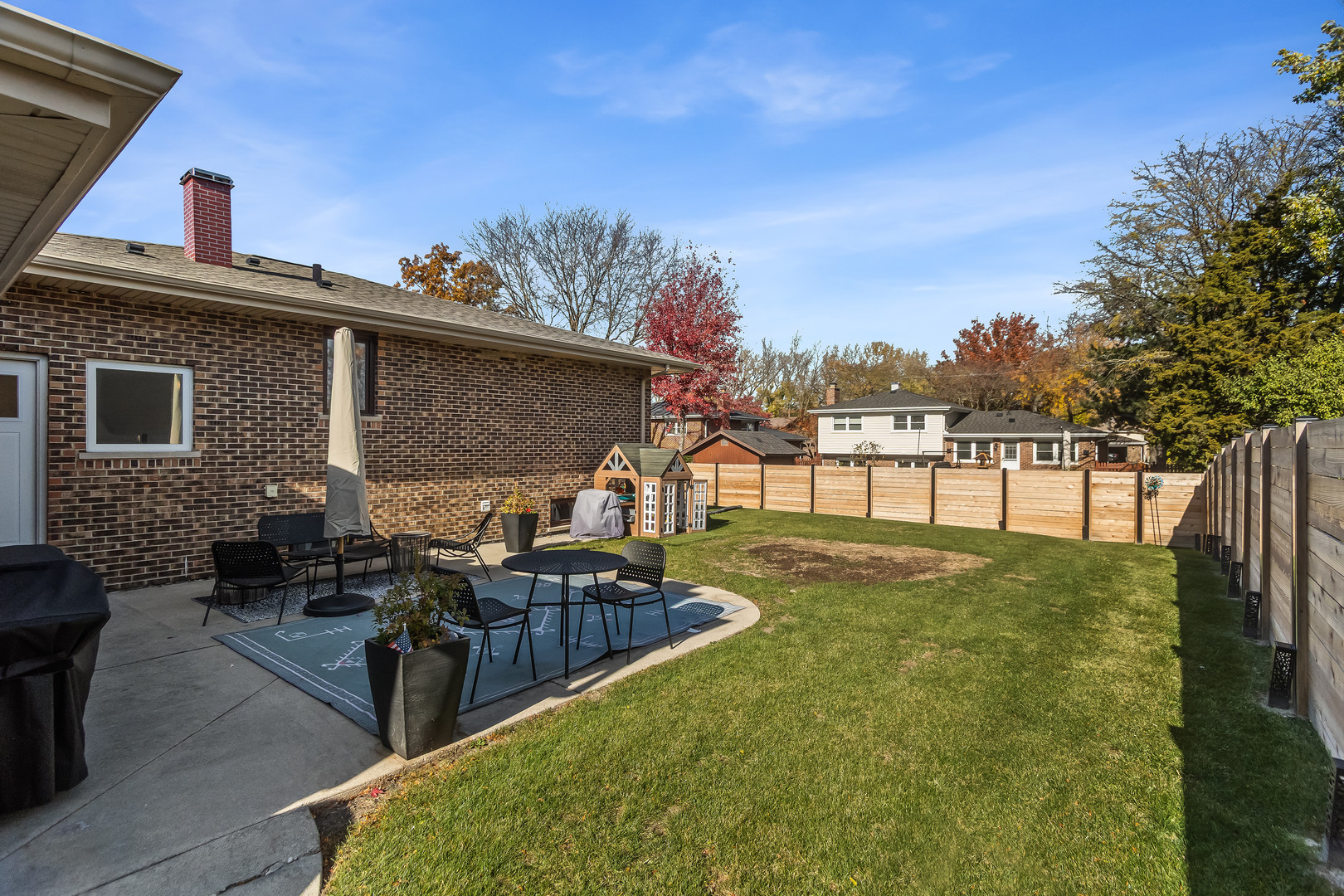 3240 Pitcher Drive Darien, IL 60561 - Photo 6 of 43 a view of a porch with furniture and a yard