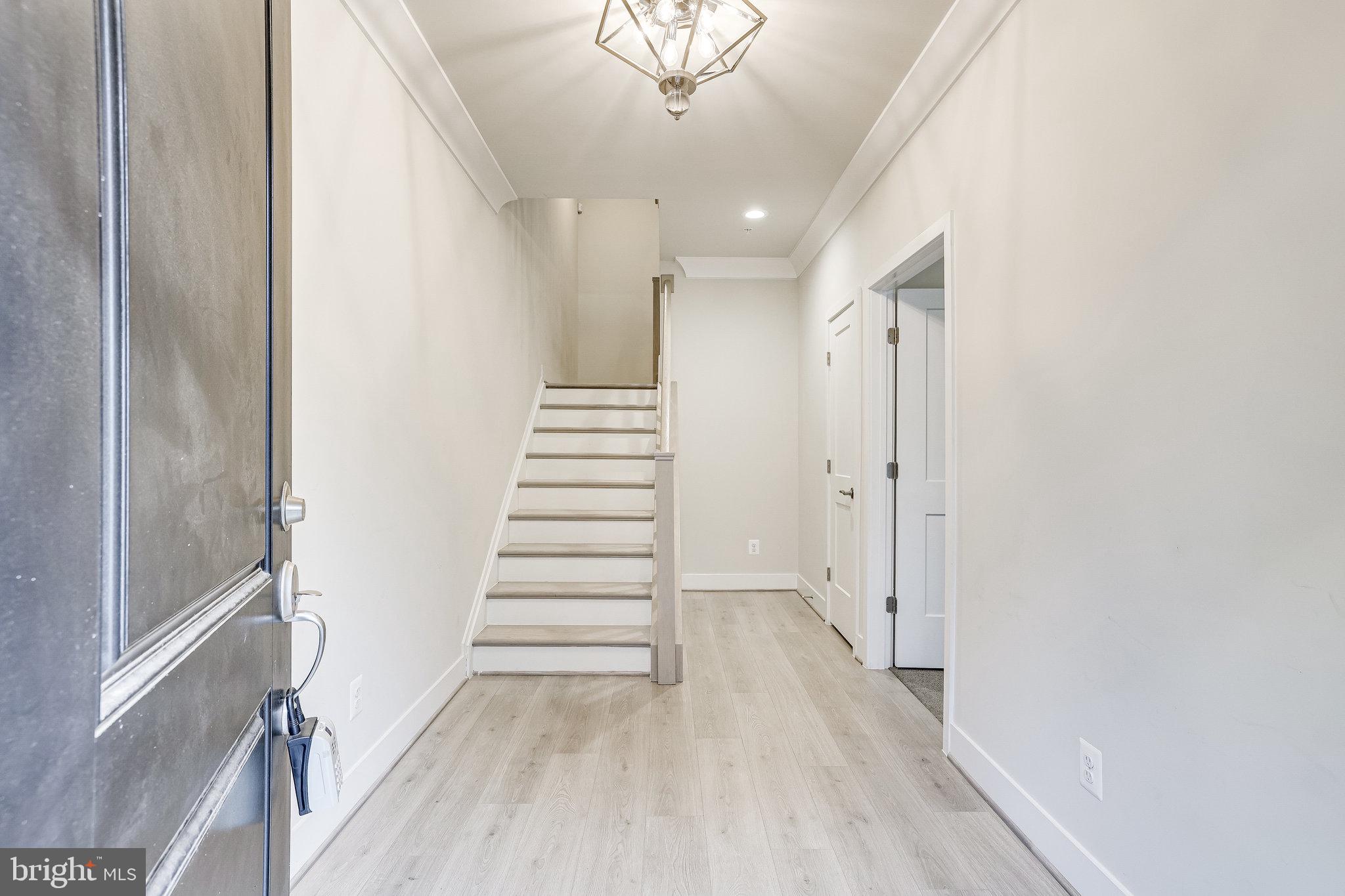 1953 Roland Clarke Place, Unit 30 Reston, VA 20191 - Photo 5 of 84 FOYER