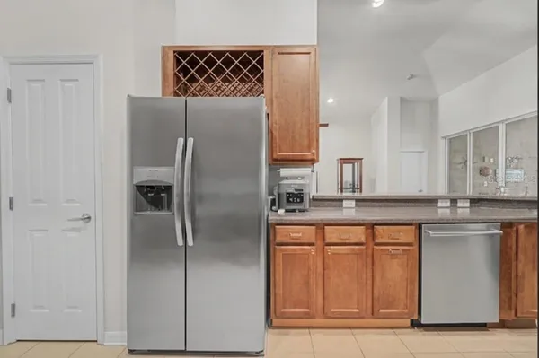 a kitchen with stainless steel appliances granite countertop a sink and cabinets