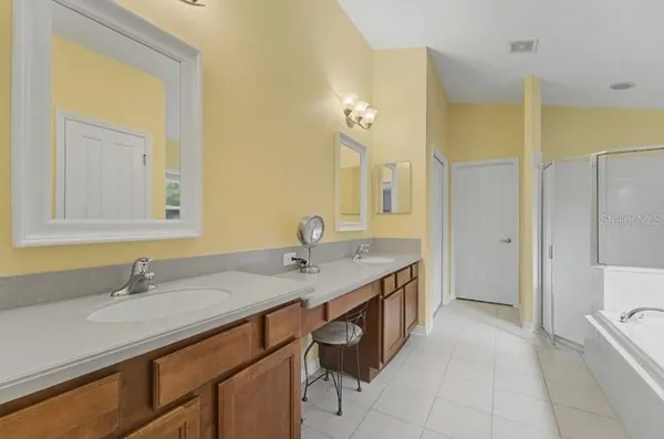 a bathroom with a toilet a sink and a mirror