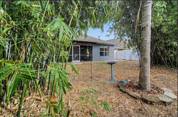 an aerial view of residential houses with city view