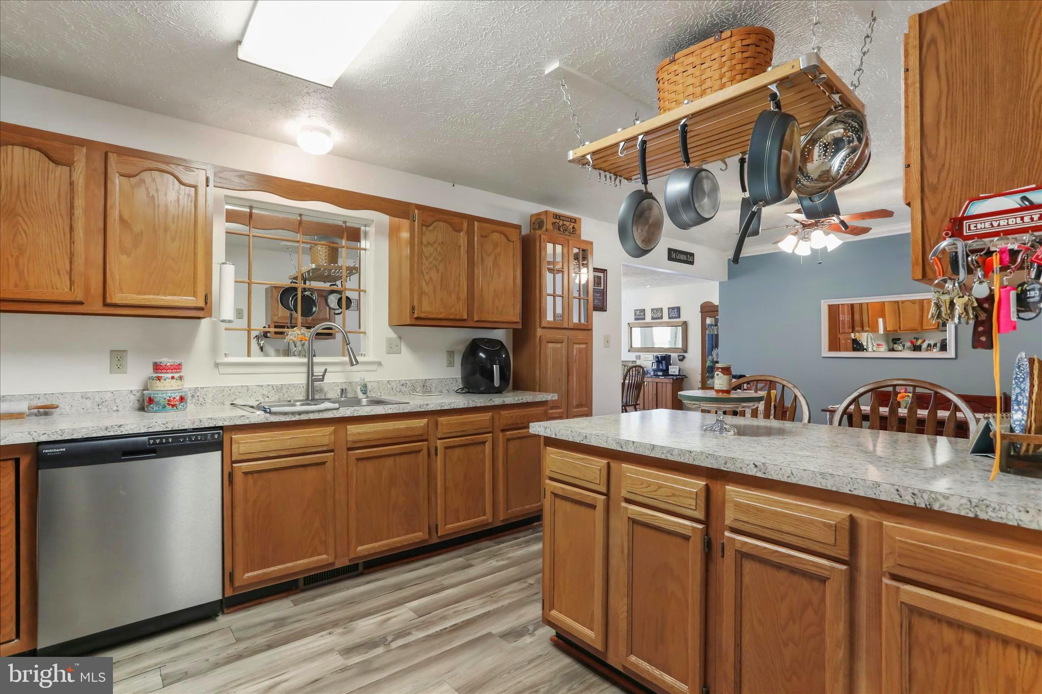 573 Lewis Street Front Royal, VA 22630 - Photo 11 of 45 a kitchen with stainless steel appliances granite countertop a sink and cabinets