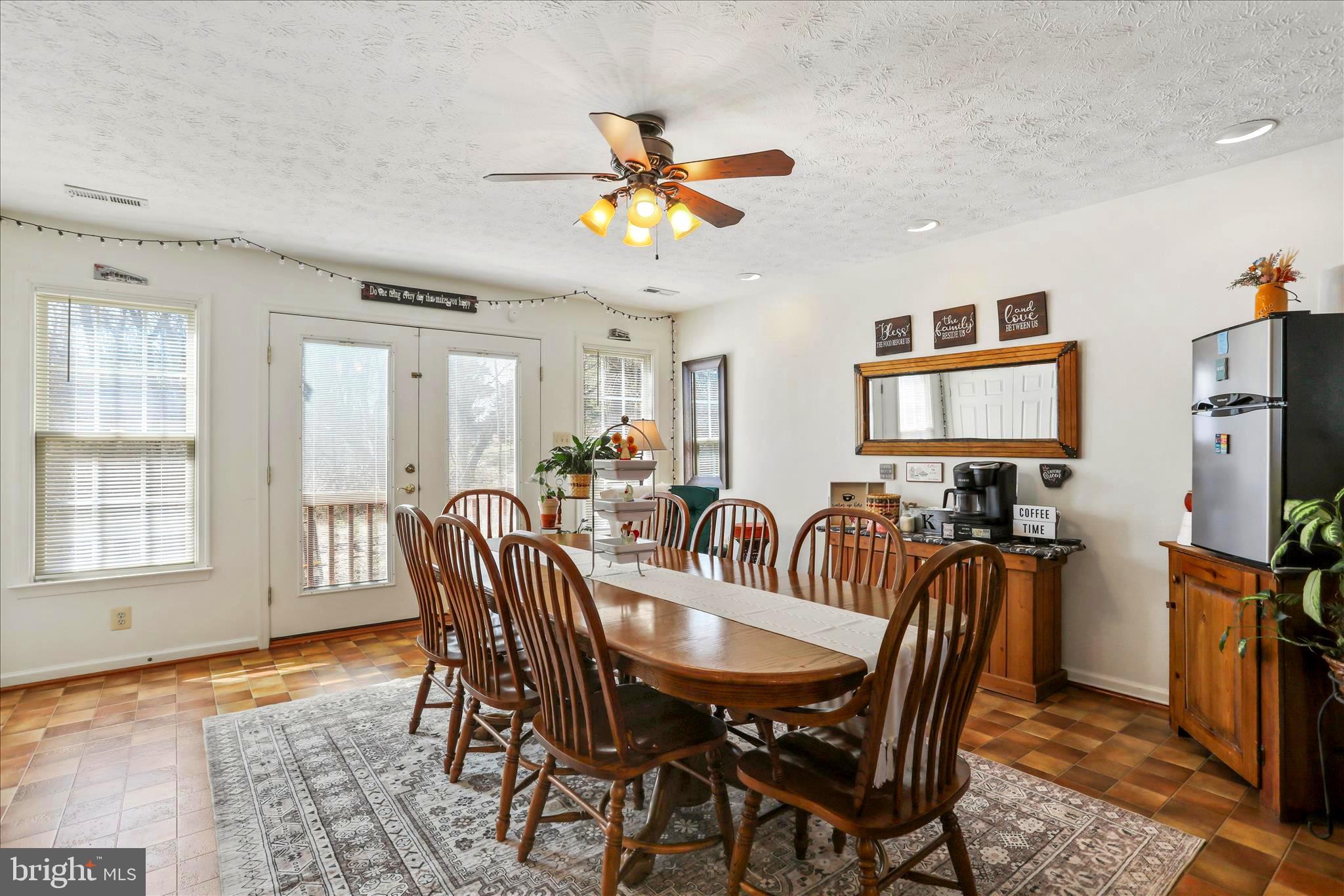 573 Lewis Street Front Royal, VA 22630 - Photo 13 of 45 a view of a a dining room with furniture window and wooden floor