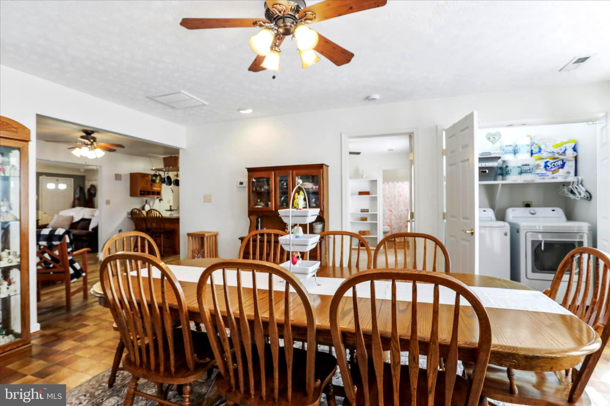 573 Lewis Street Front Royal, VA 22630 - Photo 15 of 45 a view of a dining room with furniture window and wooden floor