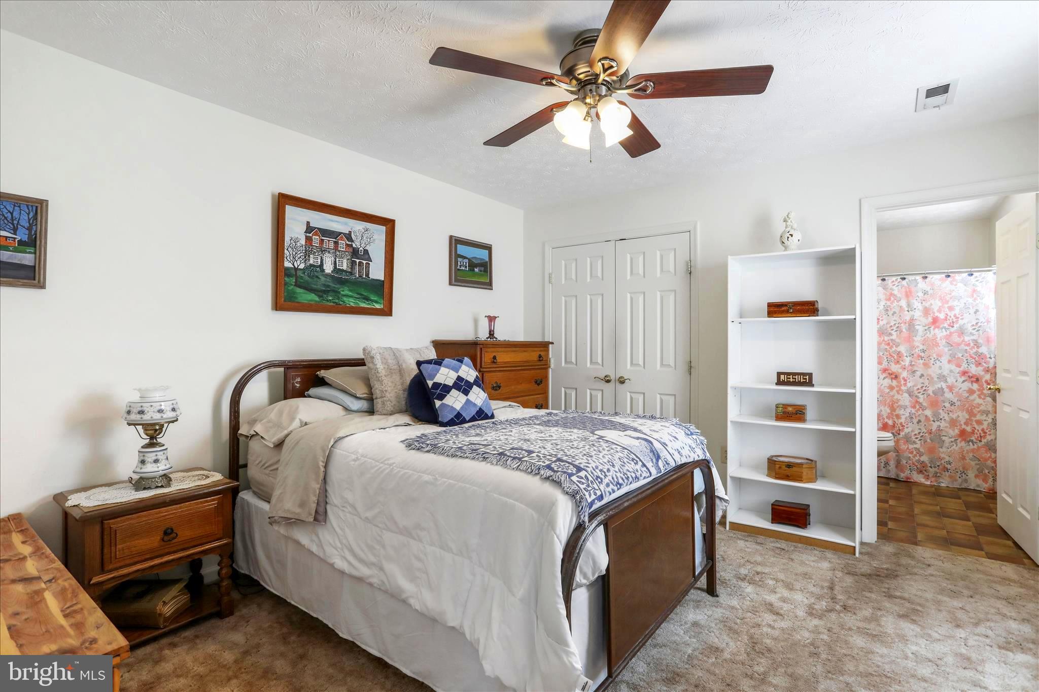 573 Lewis Street Front Royal, VA 22630 - Photo 16 of 45 a bedroom with bed and a chandelier