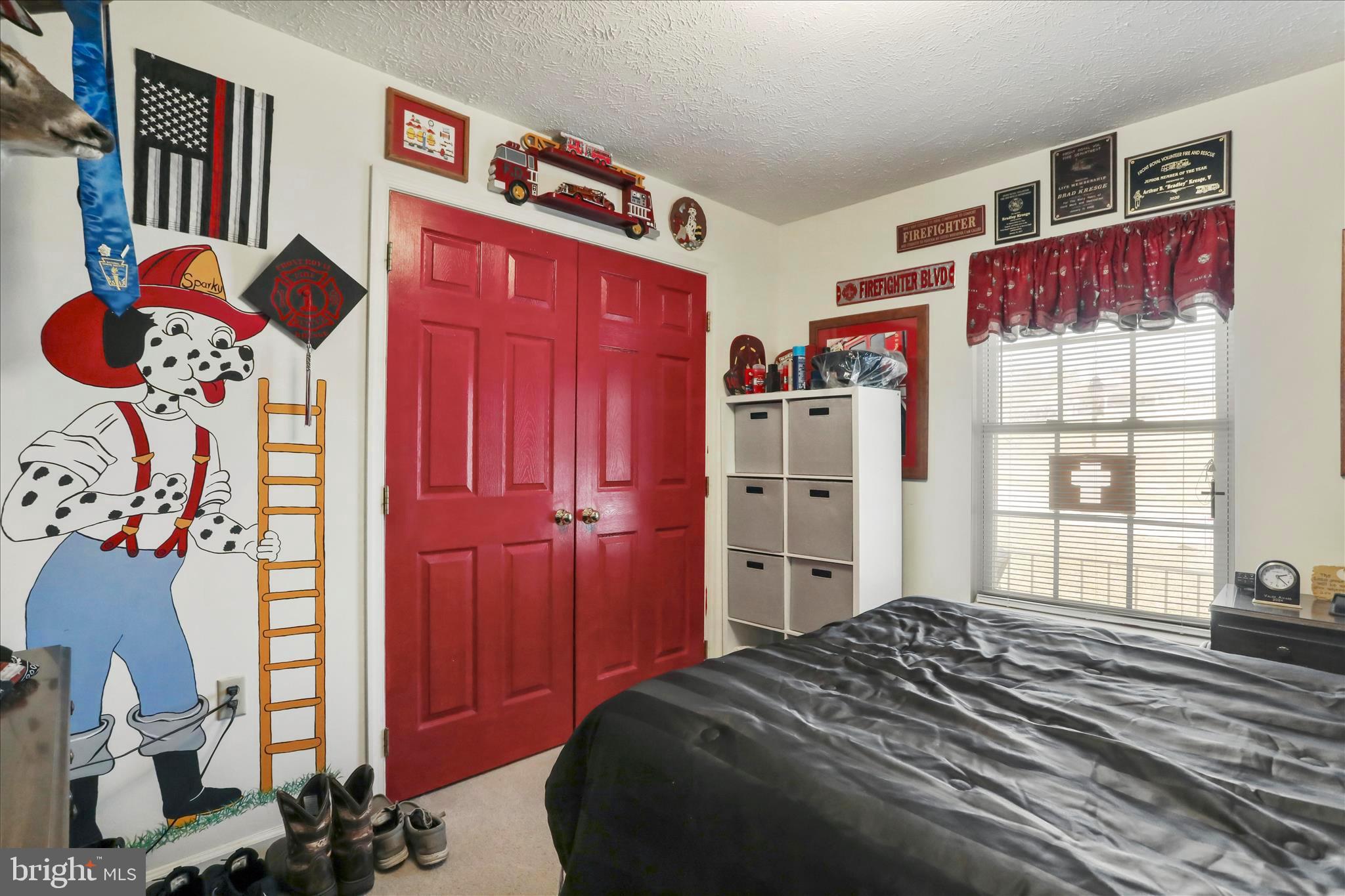 573 Lewis Street Front Royal, VA 22630 - Photo 19 of 45 a bedroom with a bed and a window