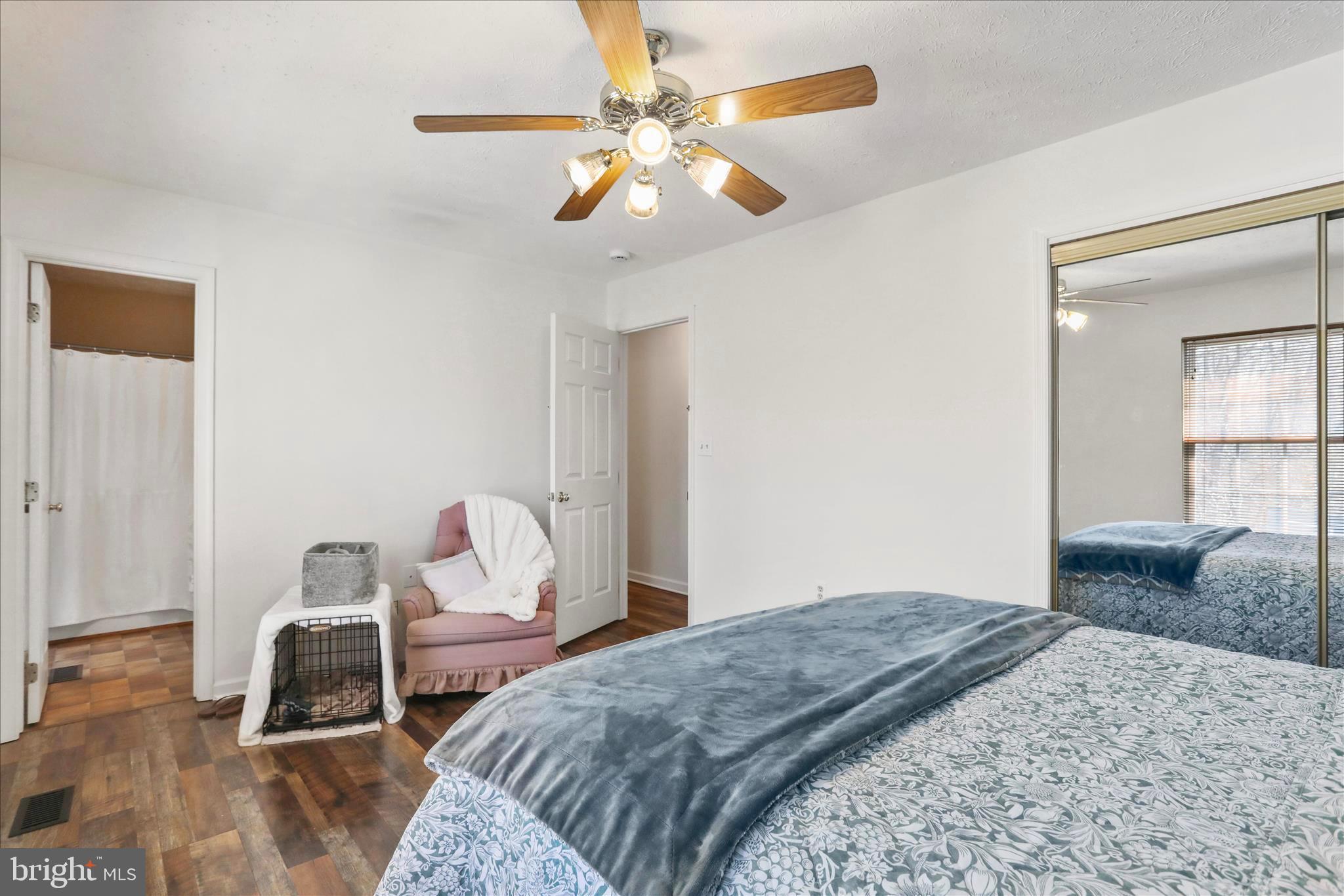 573 Lewis Street Front Royal, VA 22630 - Photo 24 of 45 a bedroom with a bed and a chandelier