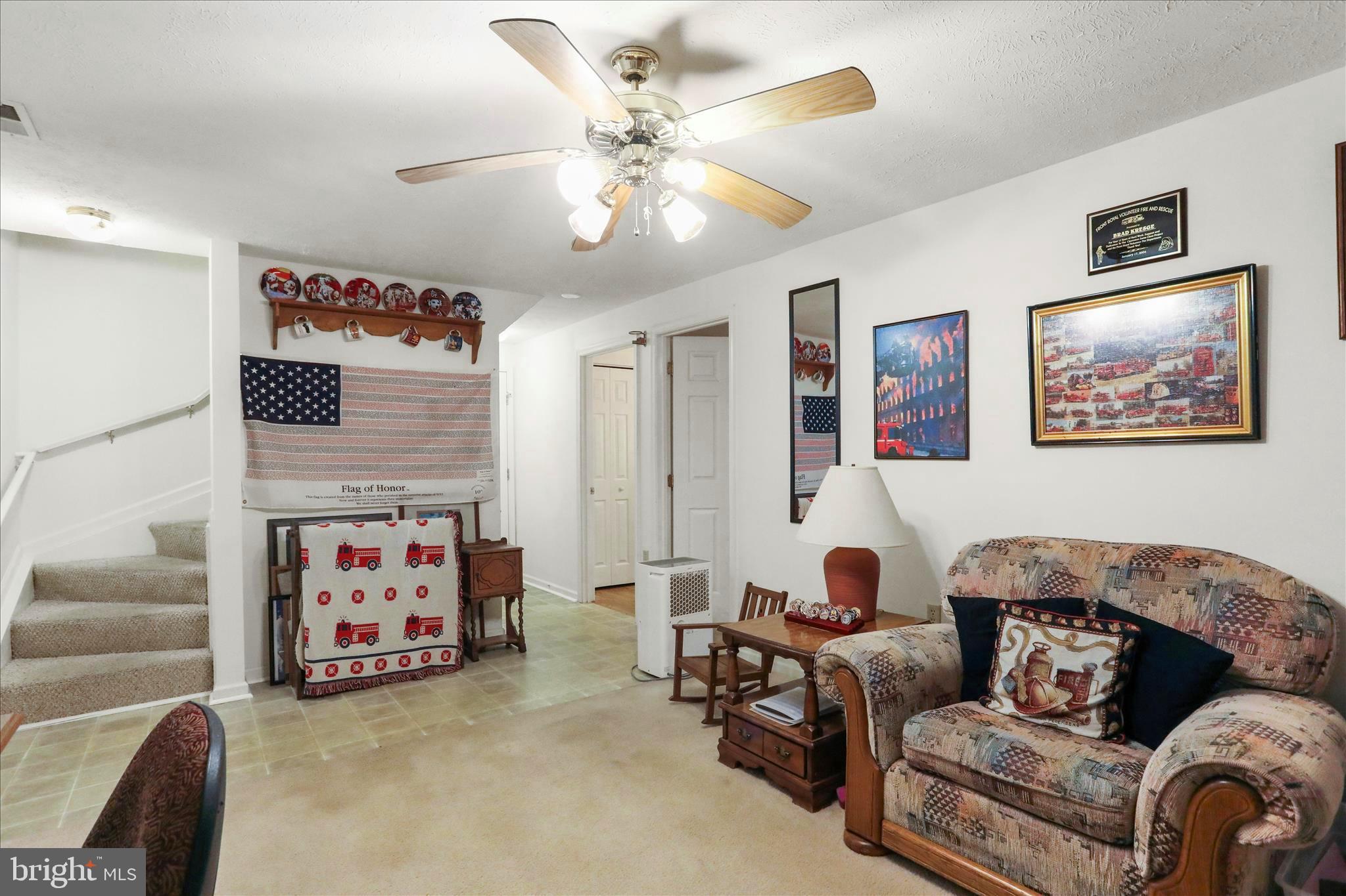 573 Lewis Street Front Royal, VA 22630 - Photo 31 of 45 a living room with furniture and a baby couch