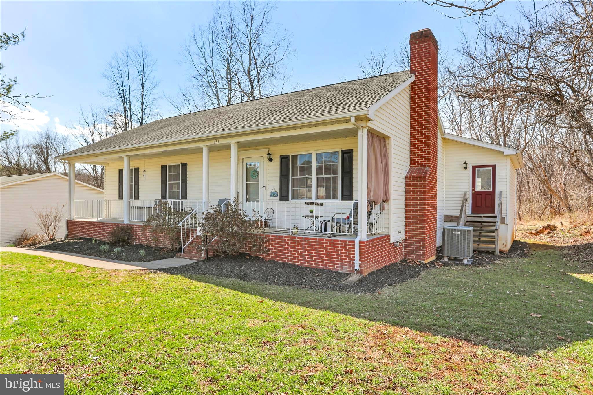 573 Lewis Street Front Royal, VA 22630 - Photo 44 of 45 a front view of house with yard patio and green space