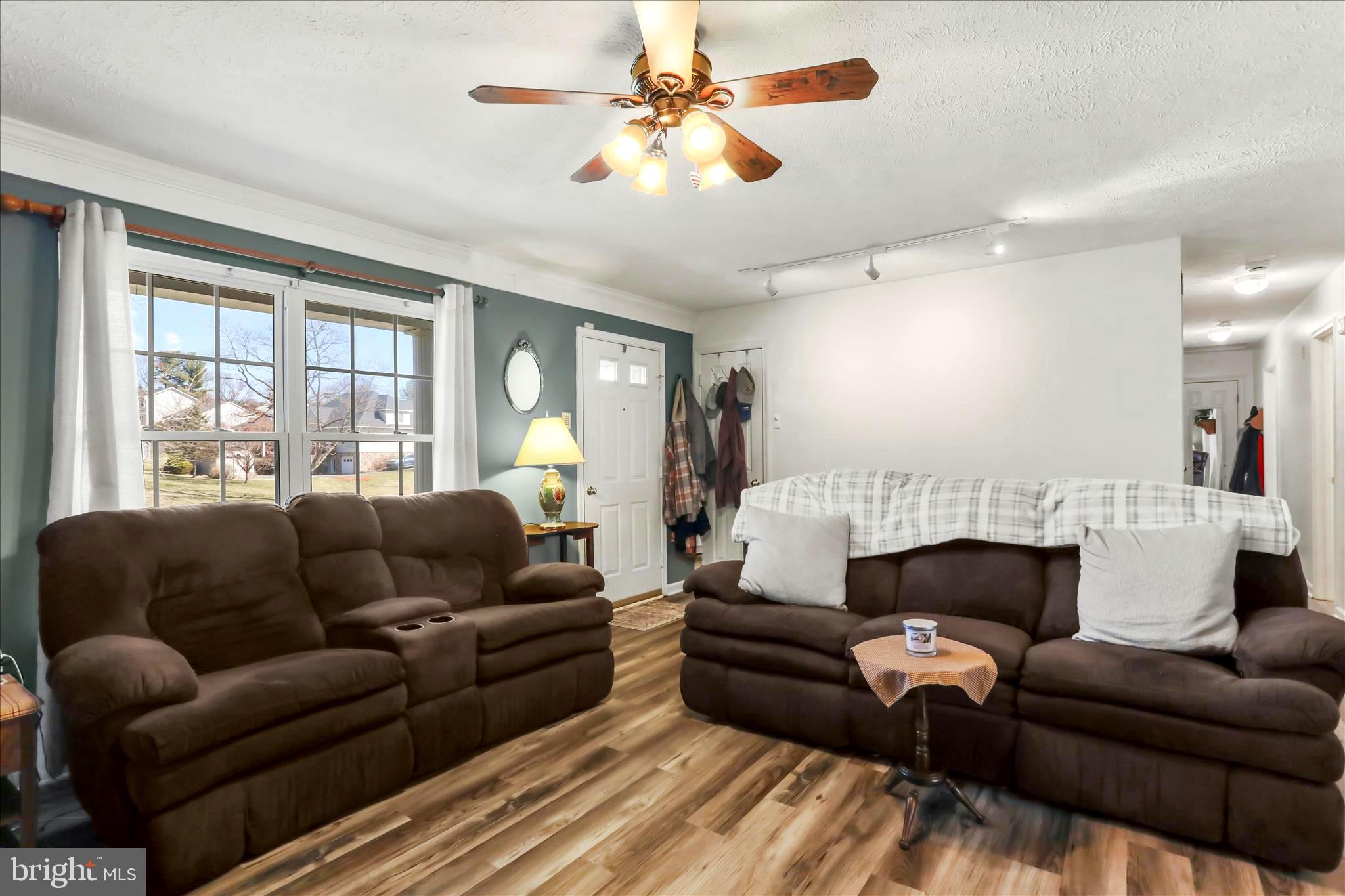 573 Lewis Street Front Royal, VA 22630 - Photo 5 of 45 a living room with furniture and a fireplace