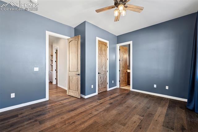 24365 Murphy Road Calhan, CO 80808 - Photo 38 of 48 Unfurnished bedroom featuring wood finished floors, ceiling fan, and ensuite bath