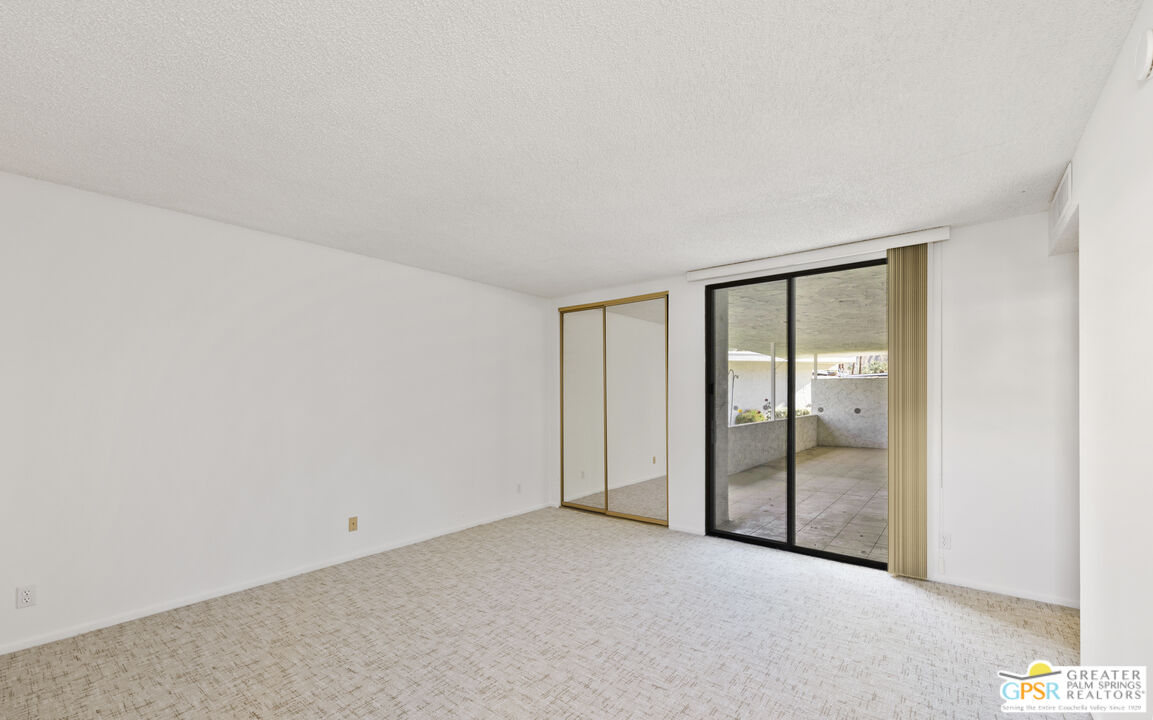 2296 Paseo Del Rey Palm Springs, CA 92264 - Photo 13 of 42 an empty room with glass door