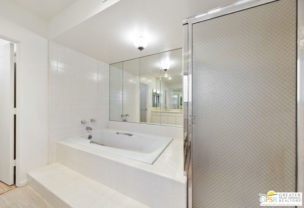 2296 Paseo Del Rey Palm Springs, CA 92264 - Photo 16 of 42 a bathroom with a bathtub and a sink