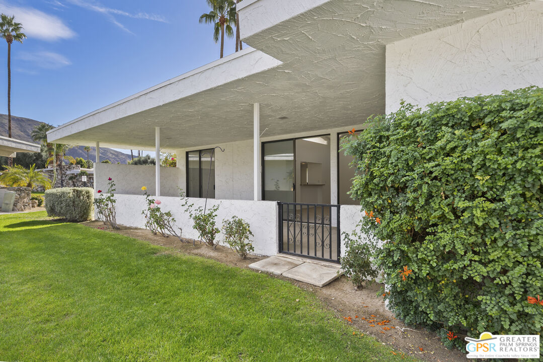 2296 Paseo Del Rey Palm Springs, CA 92264 - Photo 23 of 42 a front view of a house with a yard