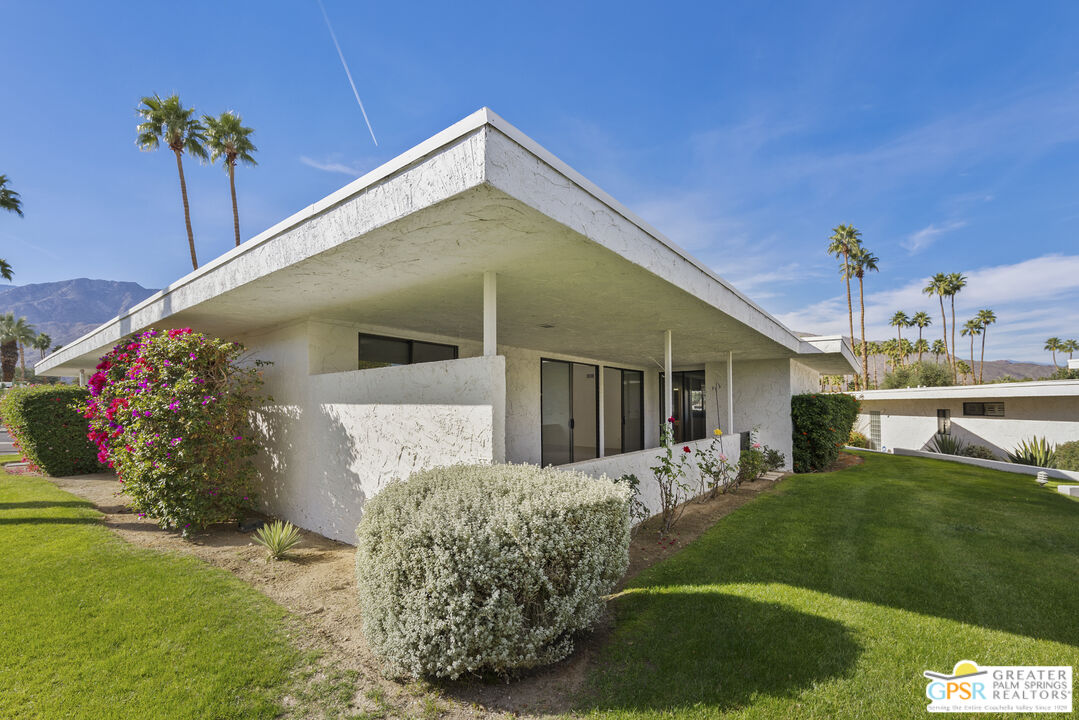 2296 Paseo Del Rey Palm Springs, CA 92264 - Photo 24 of 42 a front view of a house with a yard