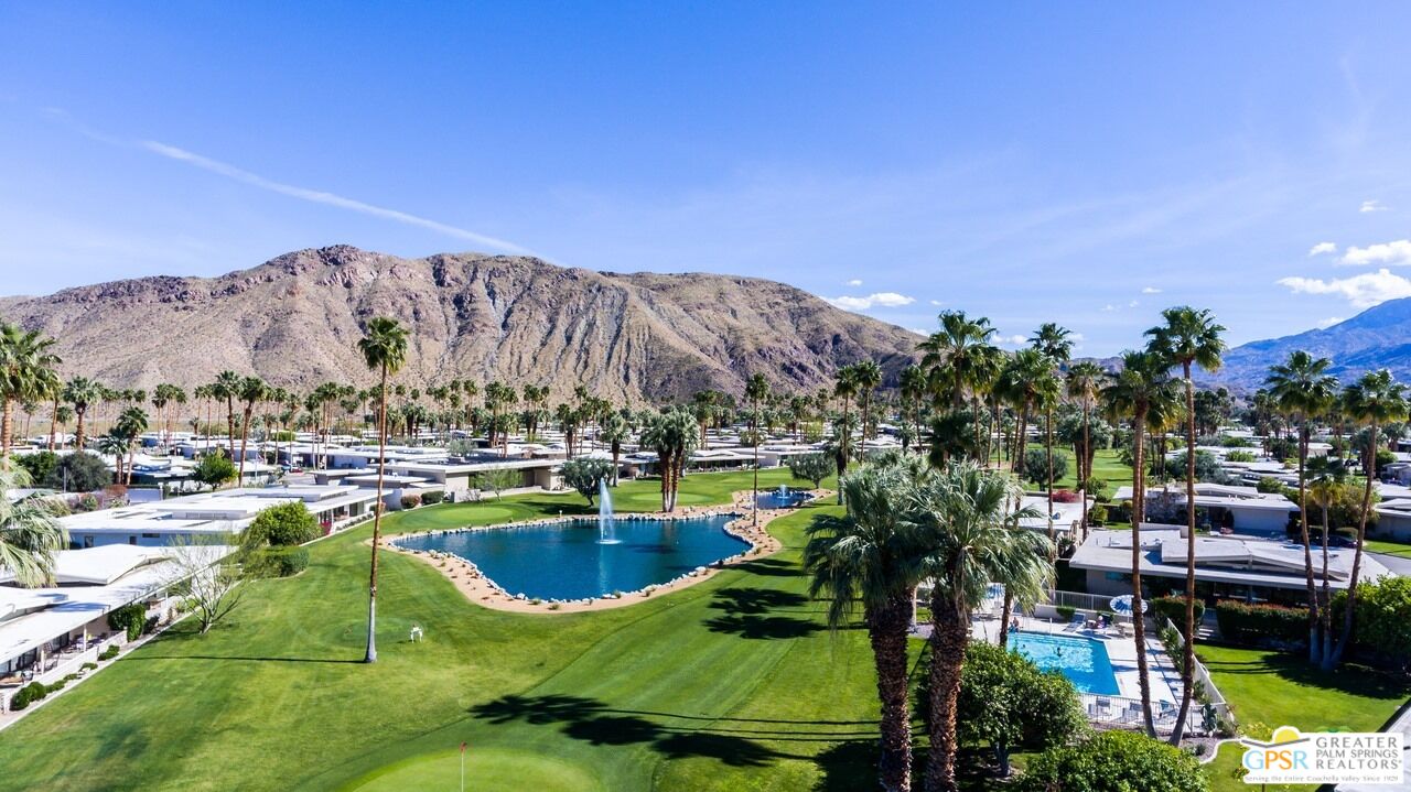2296 Paseo Del Rey Palm Springs, CA 92264 - Photo 38 of 42 a view of a swimming pool with a lake view