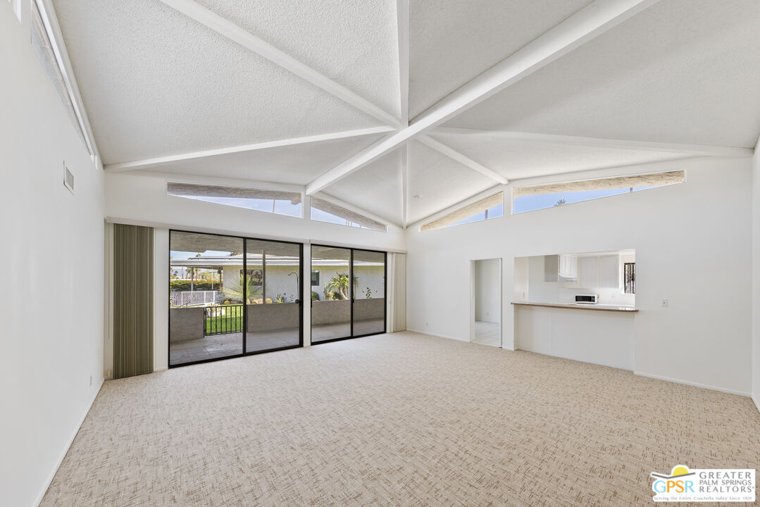 2296 Paseo Del Rey Palm Springs, CA 92264 - Photo 5 of 42 a large white room with a large window