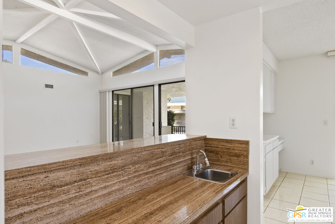 2296 Paseo Del Rey Palm Springs, CA 92264 - Photo 8 of 42 a view of an empty room with window and wooden floor