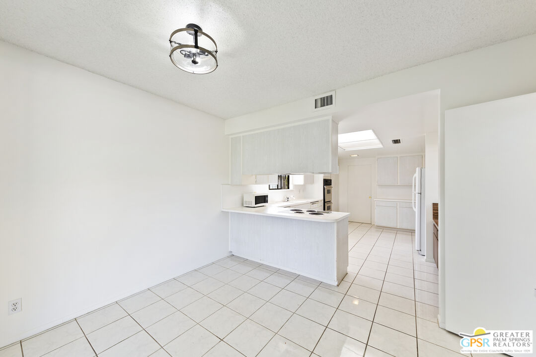 2296 Paseo Del Rey Palm Springs, CA 92264 - Photo 10 of 42 a view of a kitchen with electric appliances