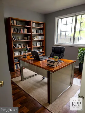 a room with furniture and a book shelf