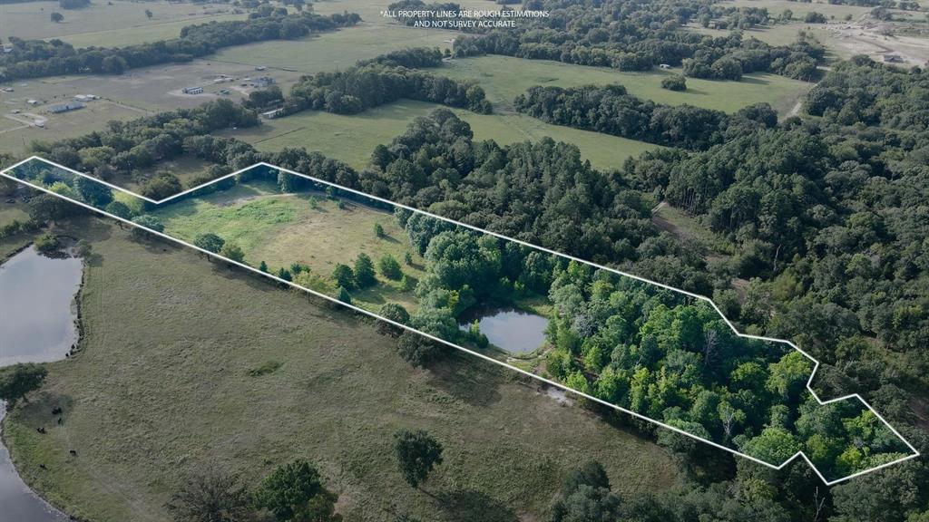 423 County Road 1560 Alba, TX 75410 - Photo 1 of 12 an aerial view of a house with a yard and lake view