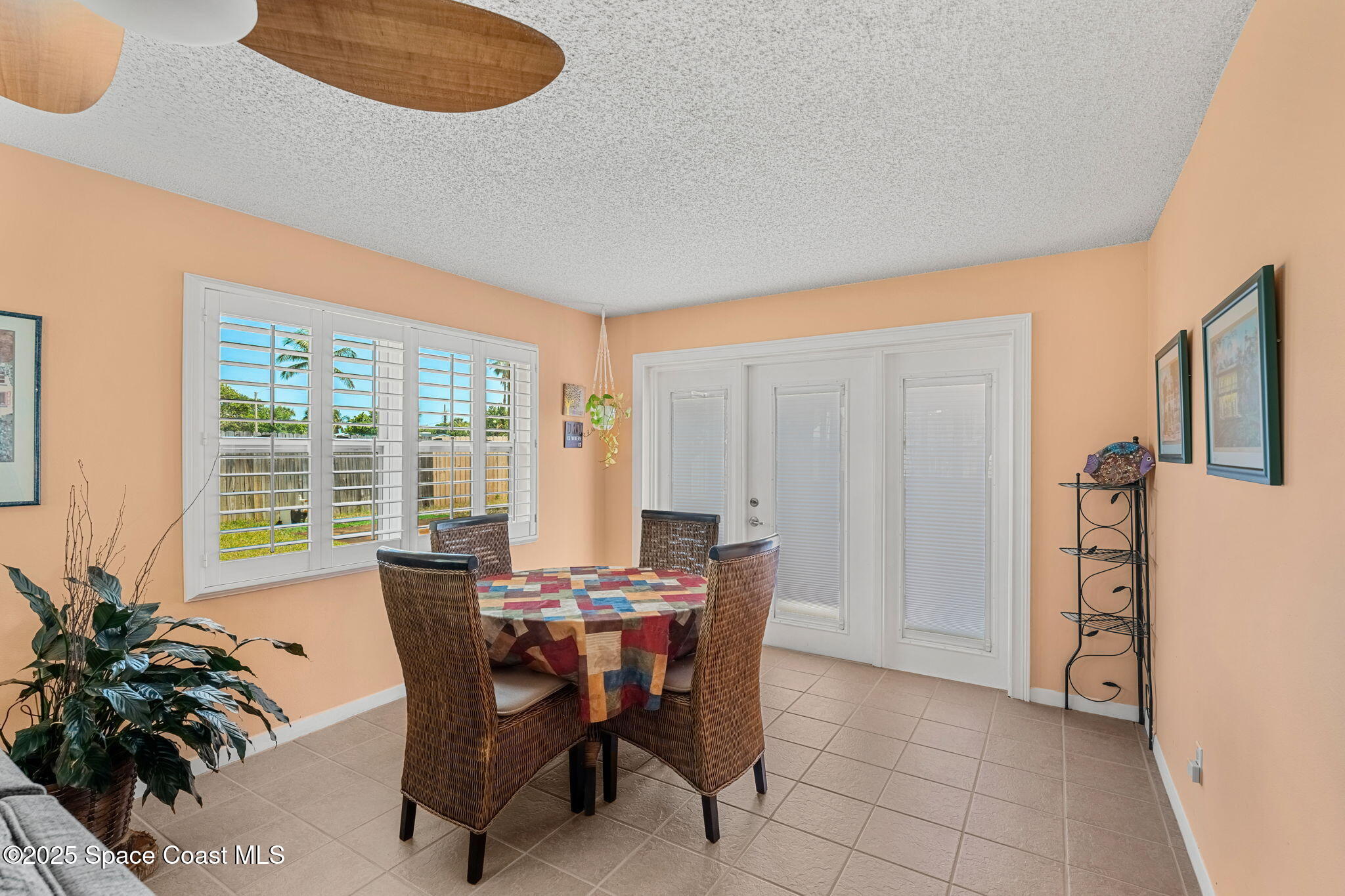 440 Pine Tree Drive Indialantic, FL 32903 - Photo 12 of 34 a view of a dining room with furniture window and outside view