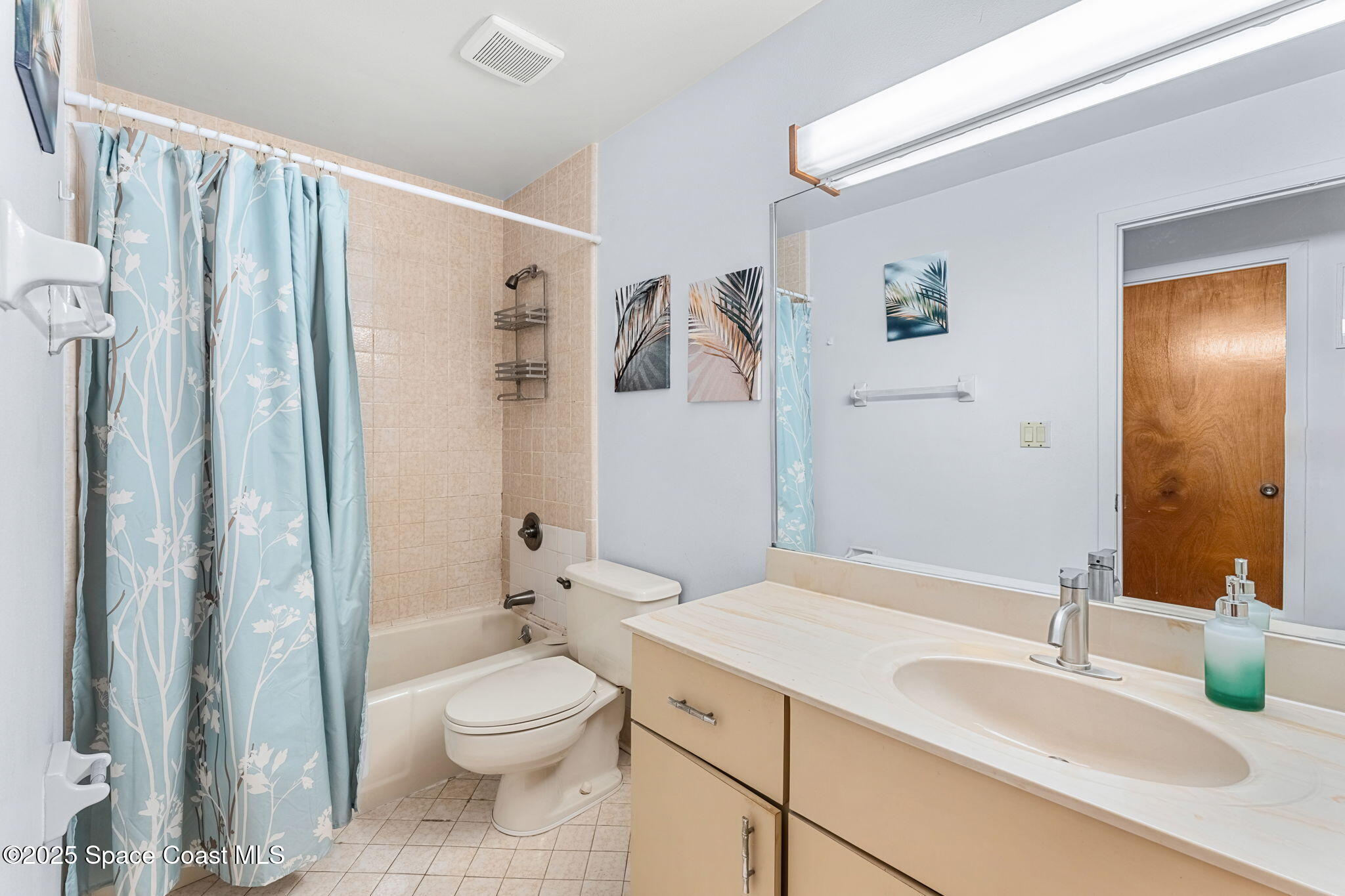 440 Pine Tree Drive Indialantic, FL 32903 - Photo 19 of 34 a bathroom with a granite countertop sink toilet and shower