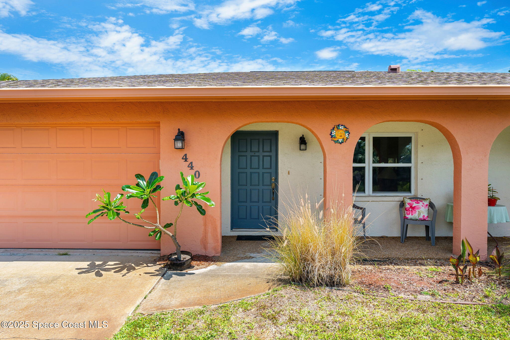 440 Pine Tree Drive Indialantic, FL 32903 - Photo 2 of 34 a view of front door and potted plants