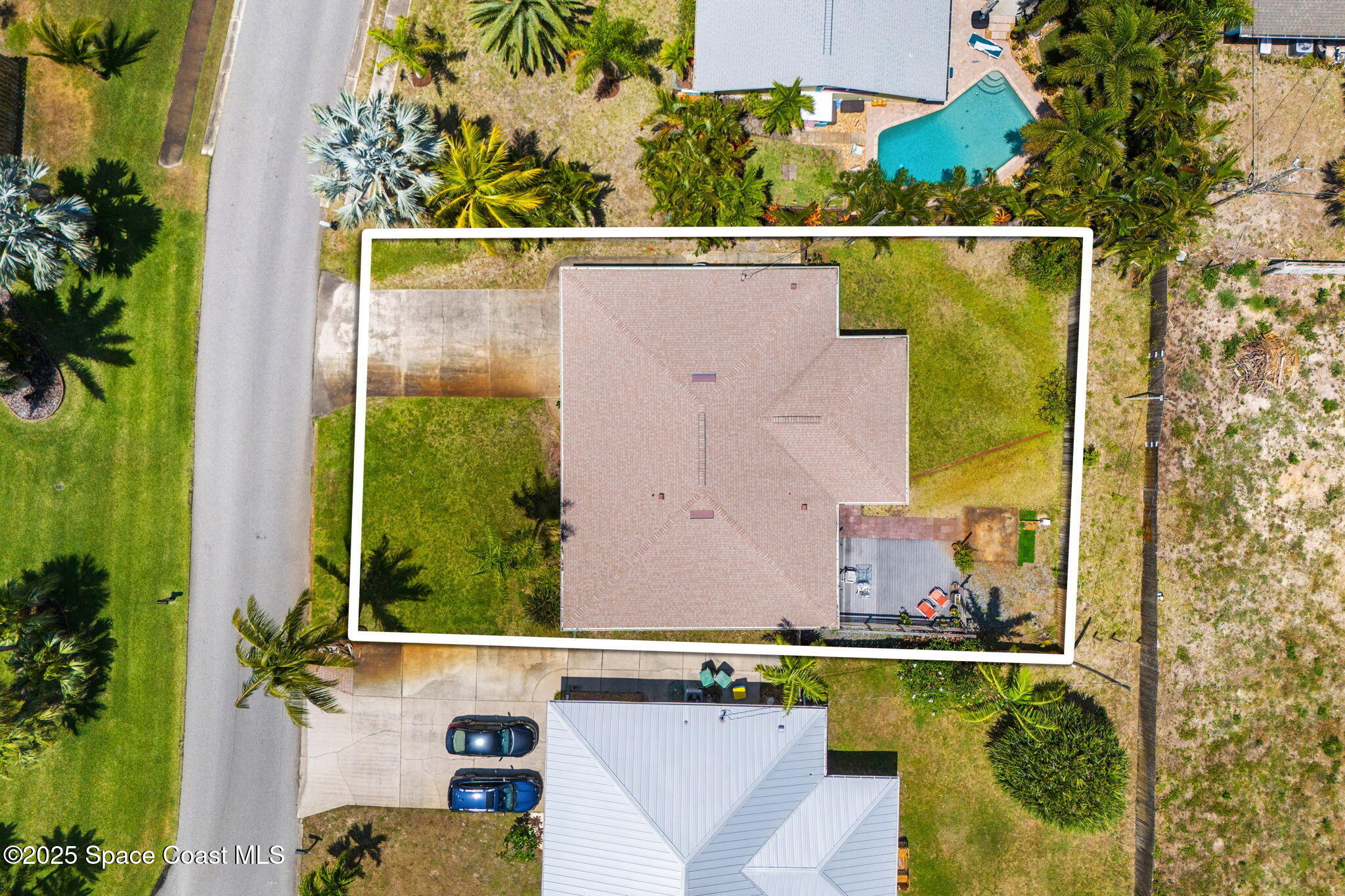 440 Pine Tree Drive Indialantic, FL 32903 - Photo 28 of 34 an aerial view of a house with a garden and swimming pool