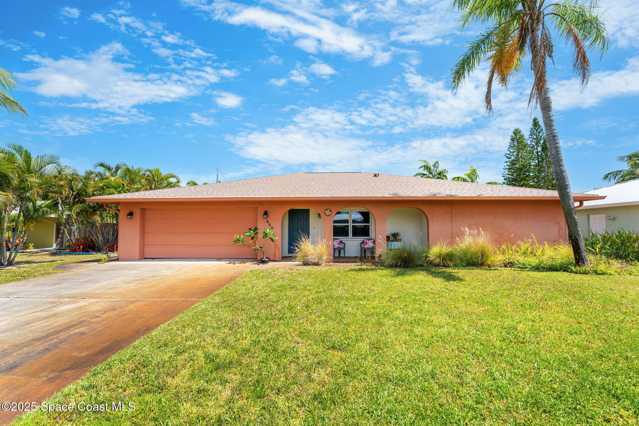 440 Pine Tree Drive Indialantic, FL 32903 - Photo 32 of 34 front view of a house with a yard